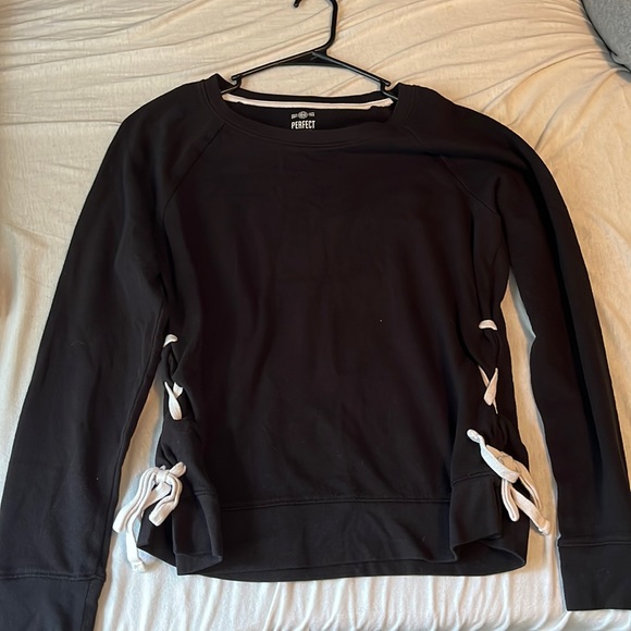 Black sweater with laced up sides. - Picture 1 of 5